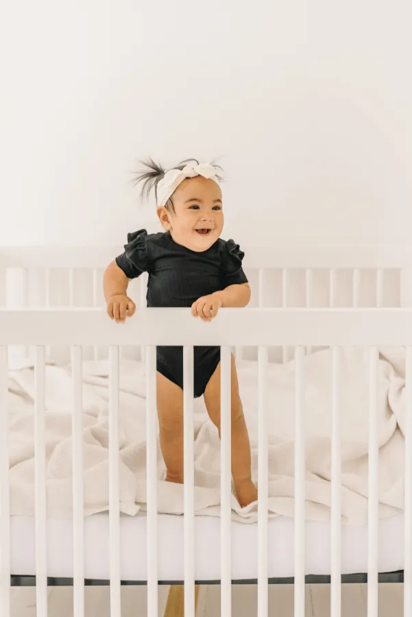 Black Ruffle Sleeve Ribbed Onesie